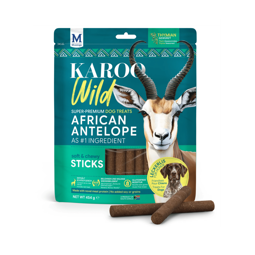 bag of karoo wild african antelope dog treats with giraffe? actually antelope image, shows kudu head and sticks outside bag.