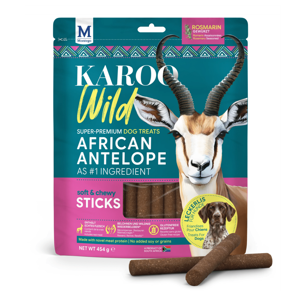 front of dog-treat bag labeled 'karoo wild' with african antelope flavor, featuring an antelope image and dog-treat sticks in the foreground.